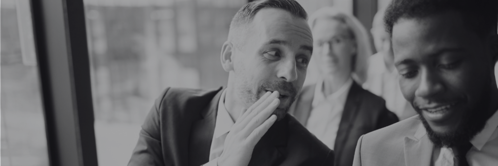 Two hiring managers discussing a new hire.